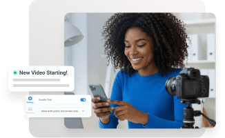 A woman sets up her camera and phone to start a live webinar, demonstrating how easy it is to automate and streamline webinars.