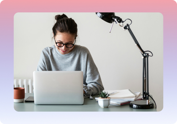 A sales representative preparing a technical product demo on a laptop.